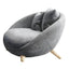 Scandinavian papasan chair with fixed back, sloped arms, cotton blend fabric, and 2 pillows