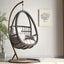 Tropical porch swing with corrosion-resistant cushions, alloy chain, and sturdy stand included
