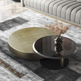 Set of two gold and black round nesting coffee tables with tempered glass tops main product image