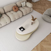 Off-white and beige minimalist rotatable coffee table with unique oval design main product image