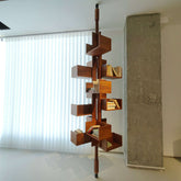360-degree rotating walnut wood bookshelf extending from floor to ceiling for stylish storage