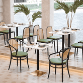 Rattan dining chairs with durable terrazzo table for an elegant dining setup main product image
