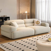 Chic off-white single sofa with biscuit back
