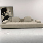 Simplistic ivory and black upholstered sofa from a side angle