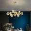 Gold 12-Light Modern Globe Chandelier with Clear Glass Shades Main Product Image