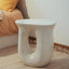 Sculptural White Concrete Side Table with Organic Curves and Elliptical Cutout