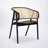 Black modern rattan dining chair with curved back