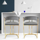 Gray velvet upholstered bar stool armchair with luxurious gold accents