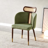 Modern green velvet dining chair with curved back design for comfortable seating