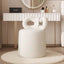 Butterfly-shaped vanity stool in cream-colored boucle fabric with soft texture main product image