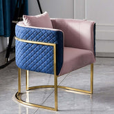 Pink and blue velvet upholstered club chair with gold barrel accent chair