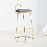 Modern gray velvet counter height bar stool with low back and gold legs in stylish design