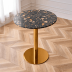 Modern marble table with sturdy metal base, perfect for adding a timeless aesthetic to any space