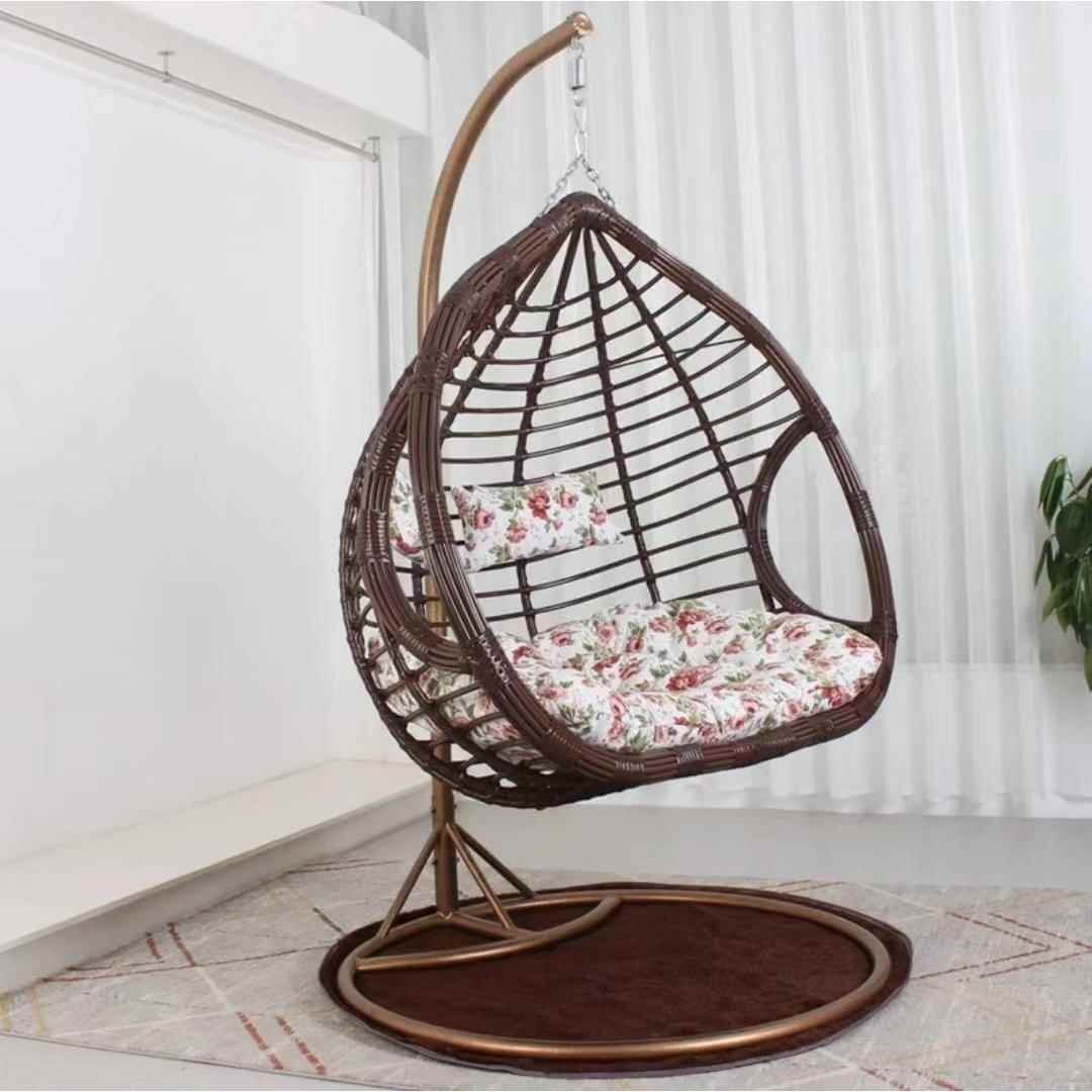 Two-seater metal porch swing egg chair with stand, cushions, and chain included