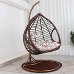 Two-seater metal porch swing egg chair with stand, cushions, and chain included