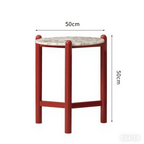 Round side table with vibrant red terrazzo top, featuring a modern minimalist design