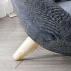 Scandinavian papasan chair with fixed back, sloped arms, cotton blend fabric, and 2 pillows