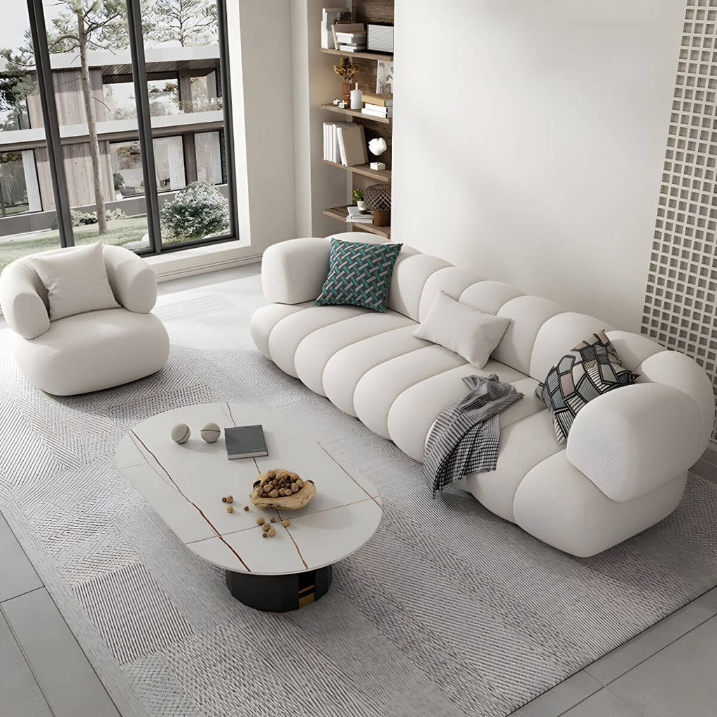 White Scandinavian fabric sofa with biscuit back and tuxedo arms