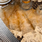 Elliptical white marble effect dining table with anti-stain and scratch-tolerant finish, seats 6 to 8