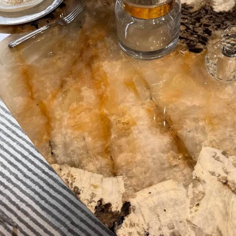 Elliptical white marble effect dining table with anti-stain and scratch-tolerant finish, seats 6 to 8