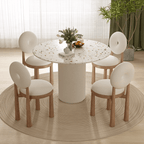 Round terrazzo dining table with soft wool upholstered chairs for a trendy home setup