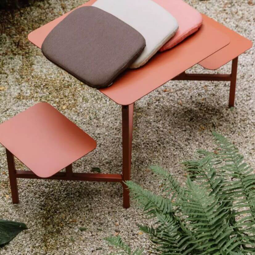 Outdoor picnic table with aluminum frame and colorful white, light green, and orange top