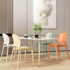 Stackable Scandinavian side chair with open back made of plastic and acrylic for dining