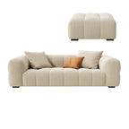 Beige upholstered wood sofa with square arms and sewn pillow back for modern living rooms