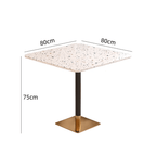 Rattan dining chairs with durable terrazzo table for an elegant dining setup