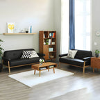 Black Scandinavian style small sofa with wood frame and faux leather upholstery