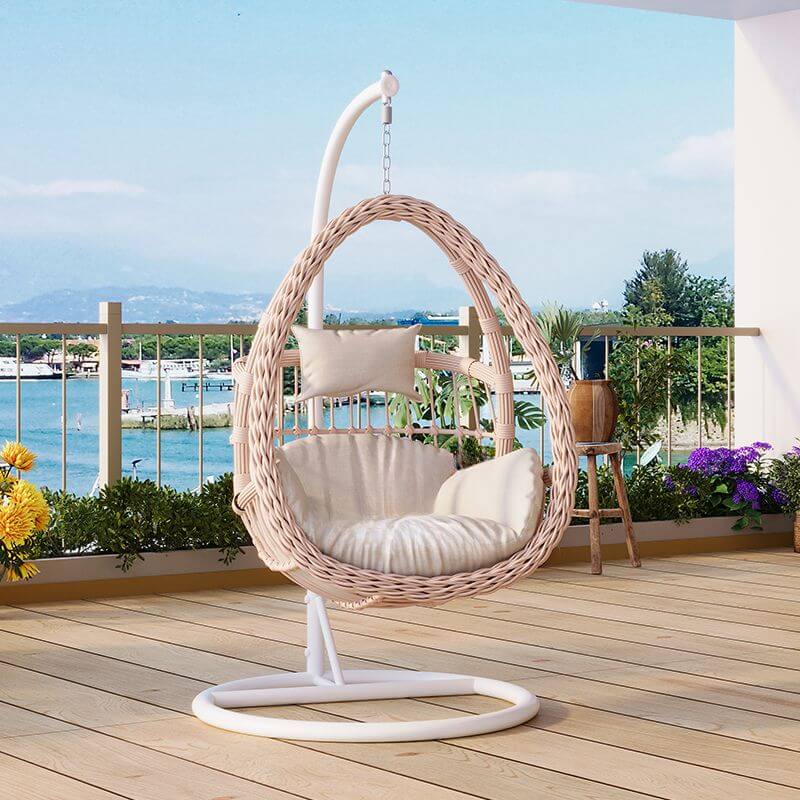 Pink metal 2-seater porch swing with stand, chain, and cushions for outdoor seating