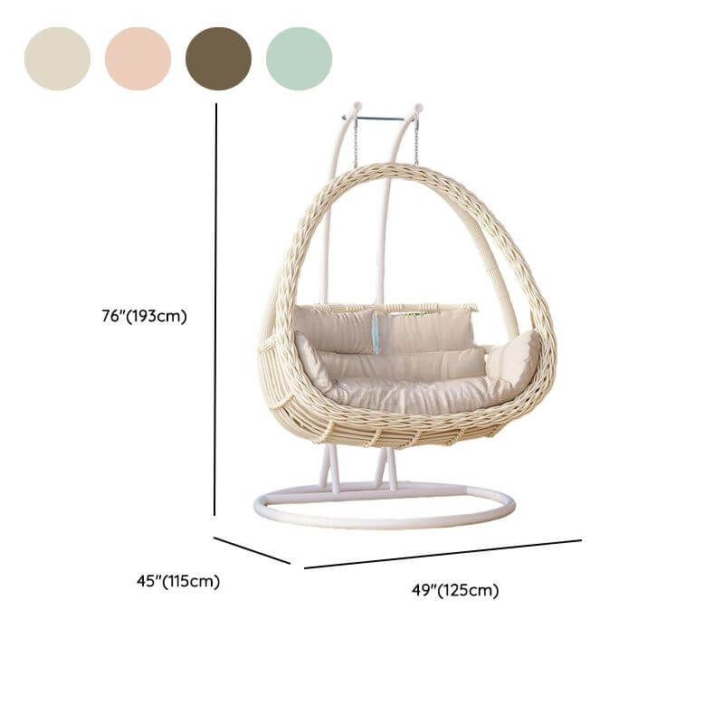 Pink metal 2-seater porch swing with stand, chain, and cushions for outdoor seating