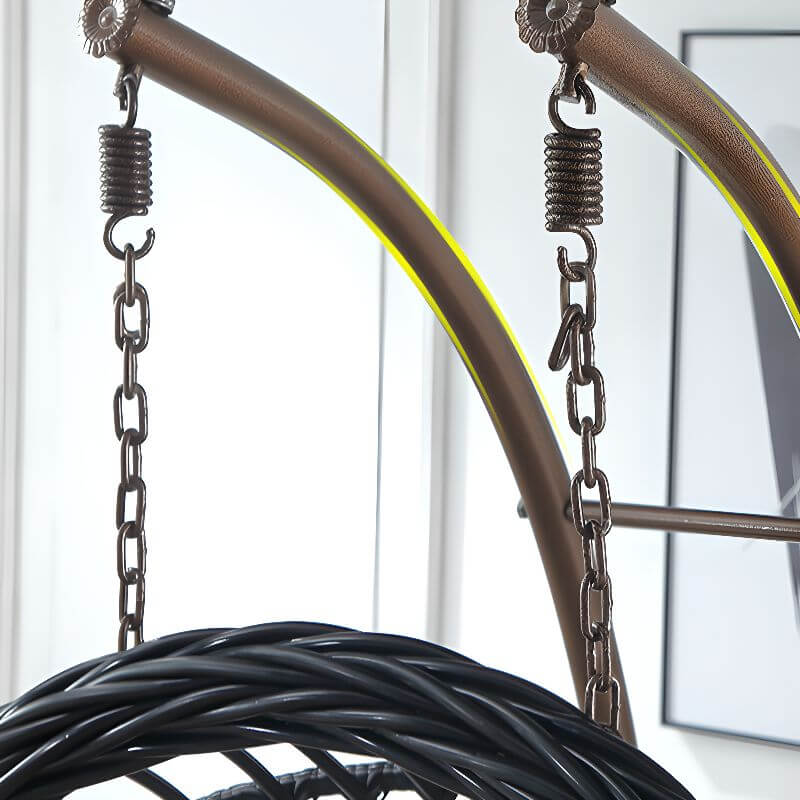 Tropical upholstered porch swing with metal chain and included stand for outdoor relaxation