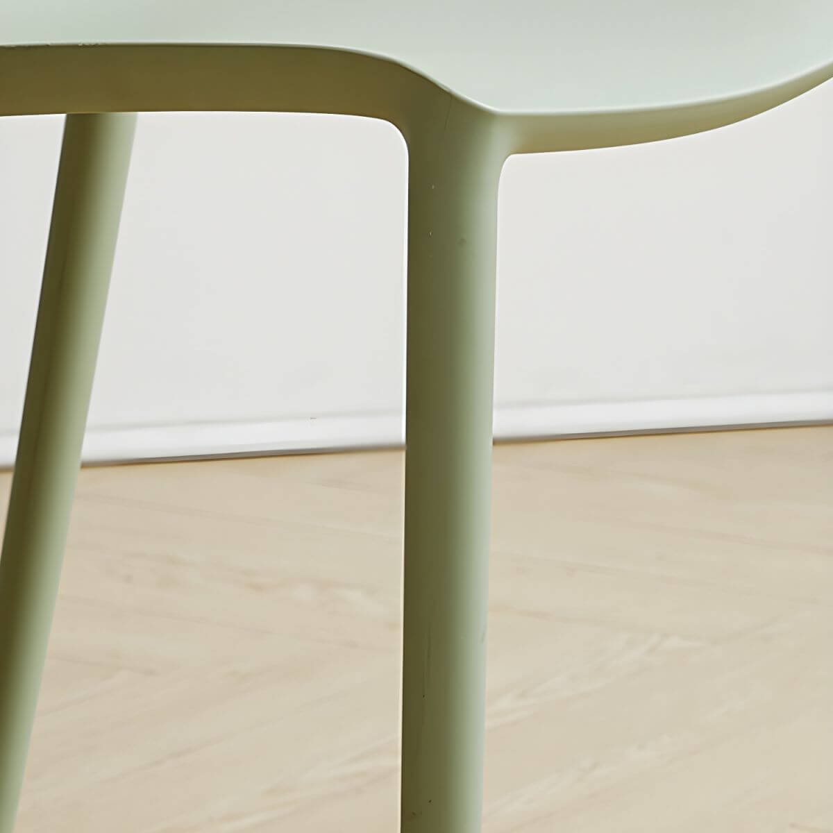 Stackable modern Scandinavian plastic and acrylic chair for kitchen and dining use