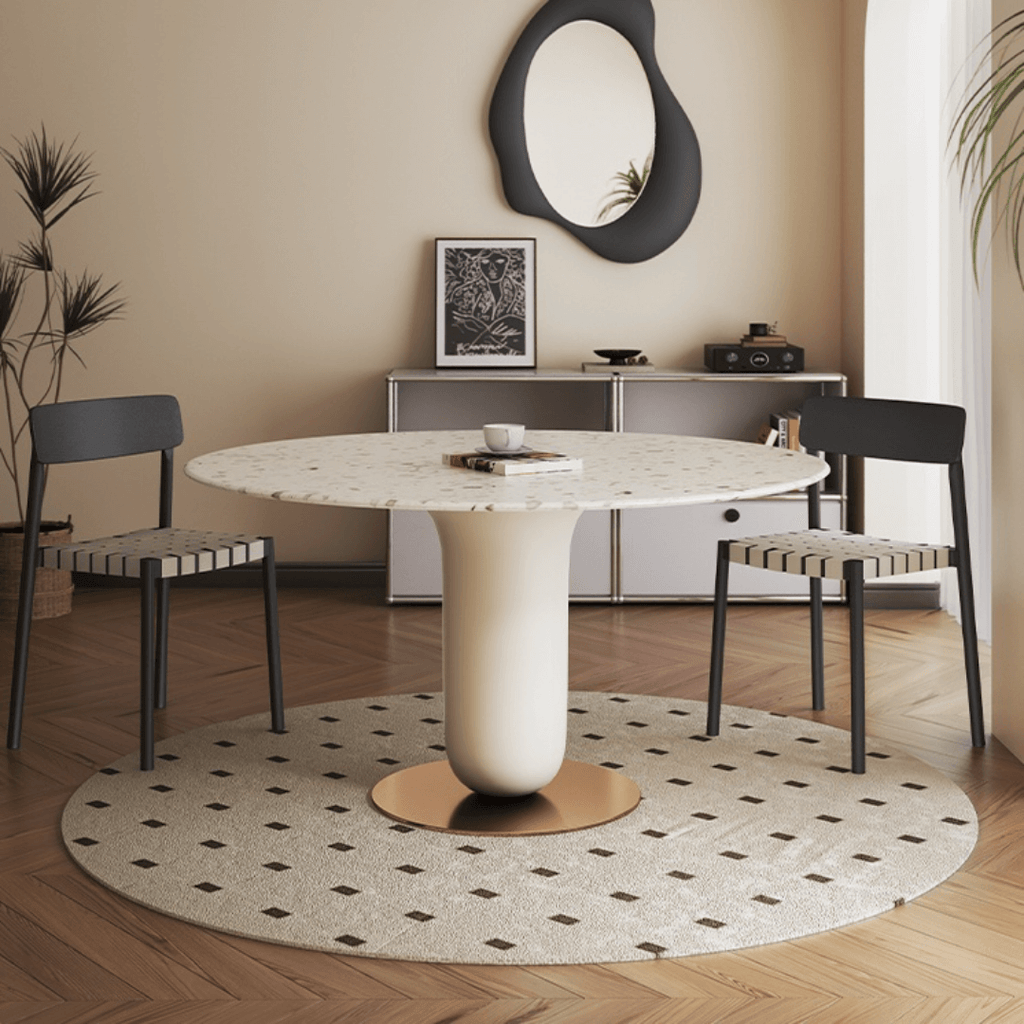 Round terrazzo dining table featuring a stylish wooden and metal base for elegant interiors