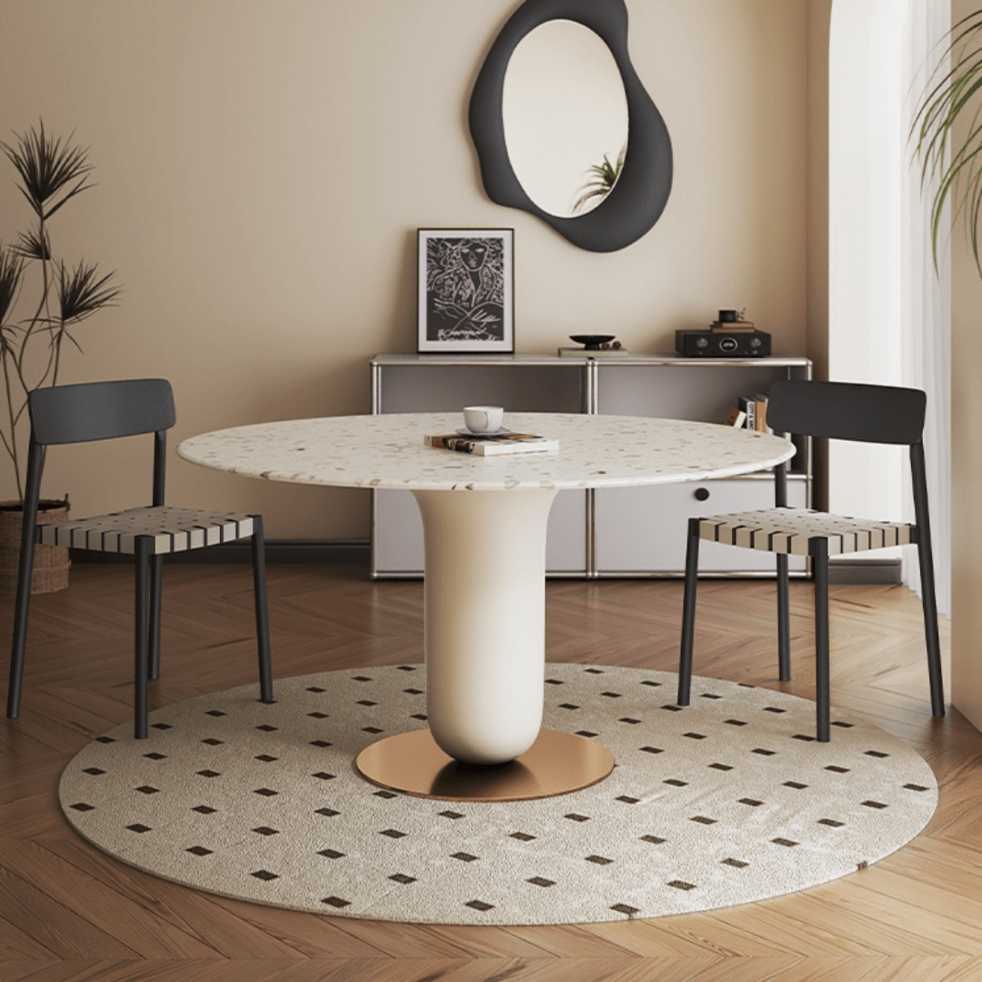 Round terrazzo dining table featuring a stylish wooden and metal base for elegant interiors