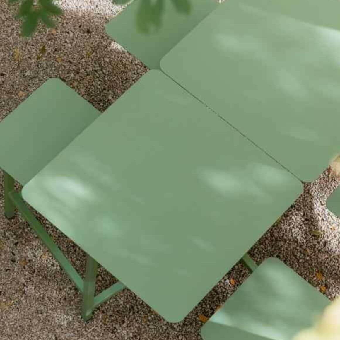 Outdoor picnic table with aluminum frame and colorful white, light green, and orange top