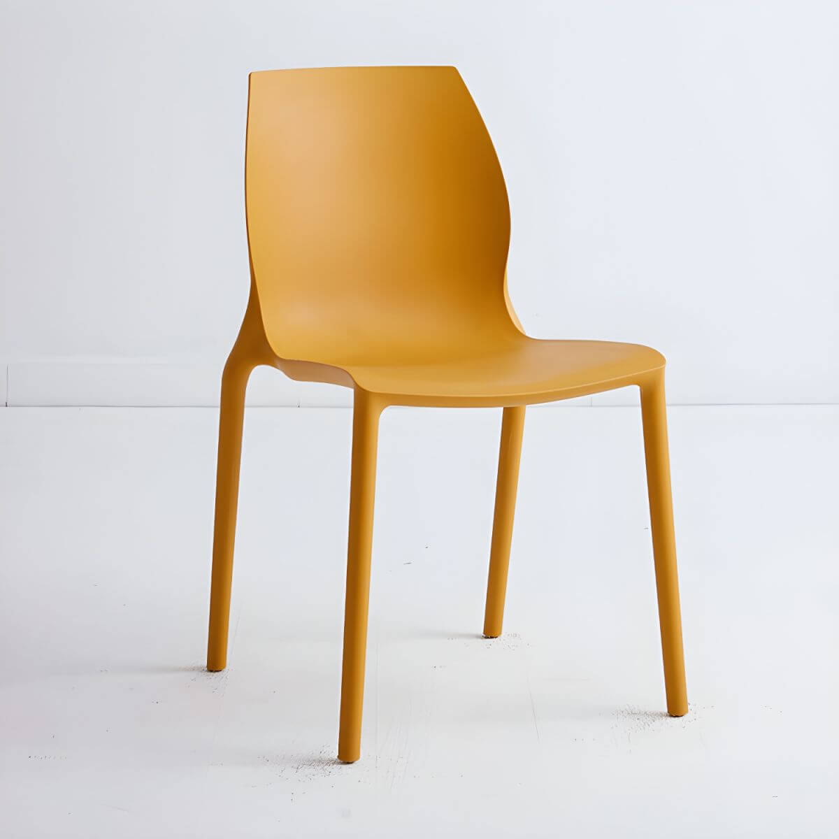Stackable modern Scandinavian plastic and acrylic chair for kitchen and dining use