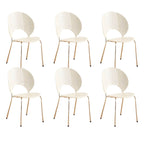 Stackable Scandinavian style dining chair with plastic seat, acrylic back, and silver legs