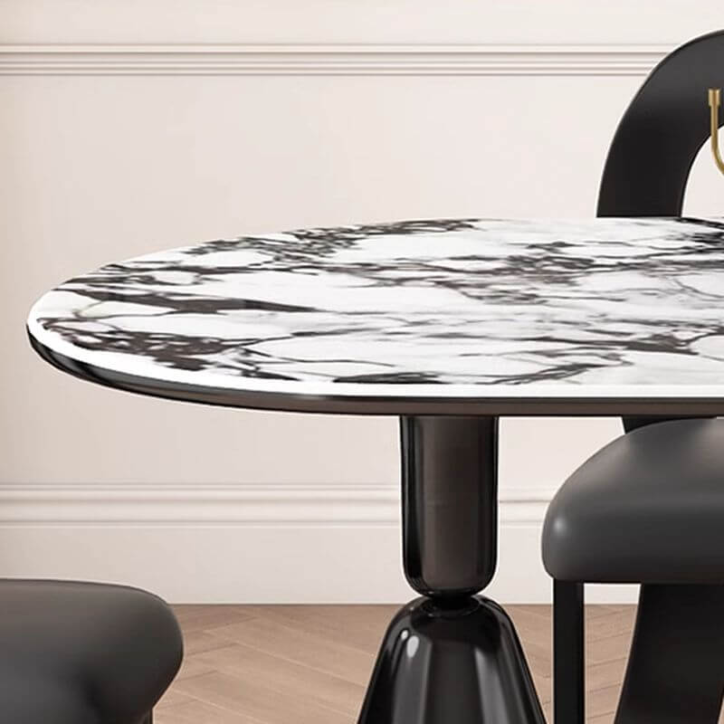 Oval marble dining table set with dual footing, solid back panel, and cushioned chairs