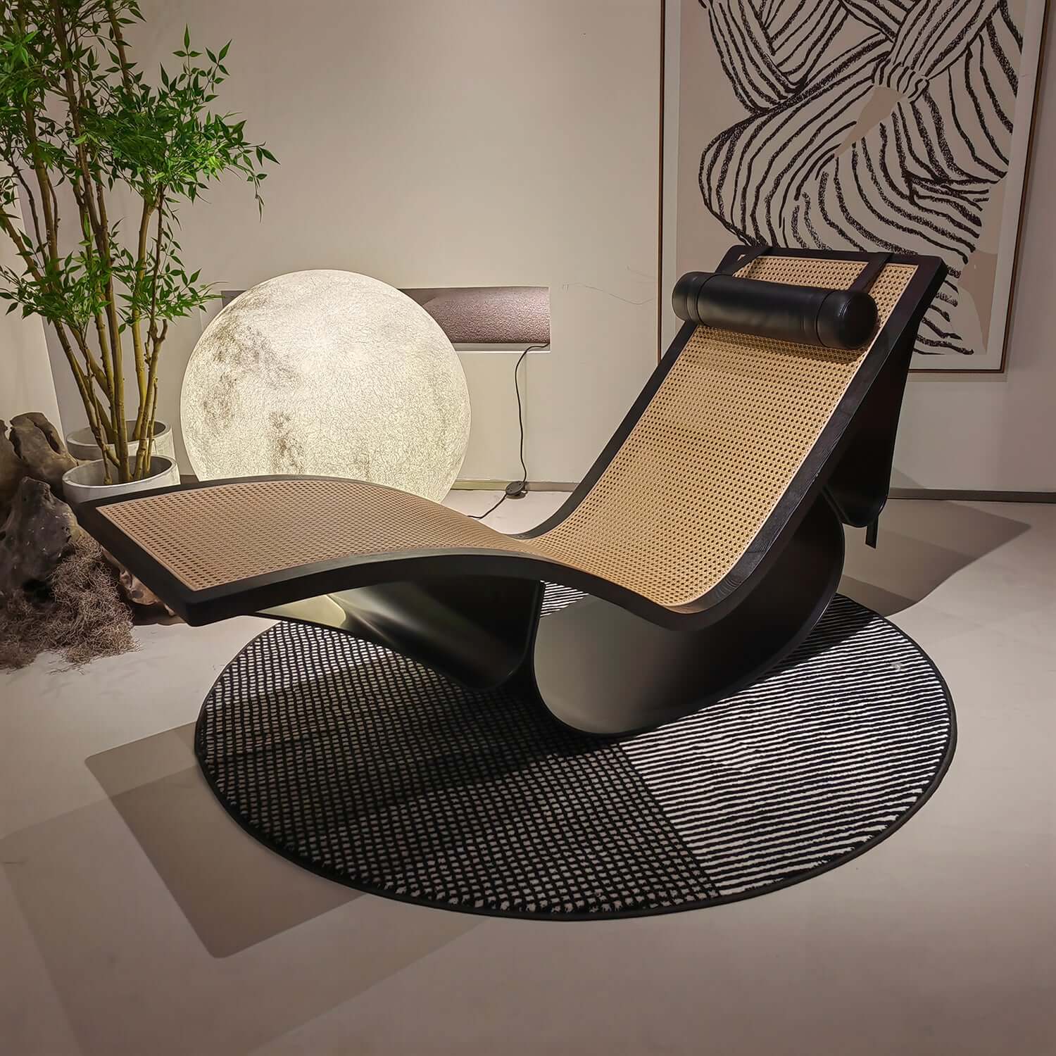 Black vintage chaise lounge chair made of cane wood with elegant design