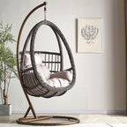 Tropical porch swing with corrosion-resistant cushions, alloy chain, and sturdy stand included
