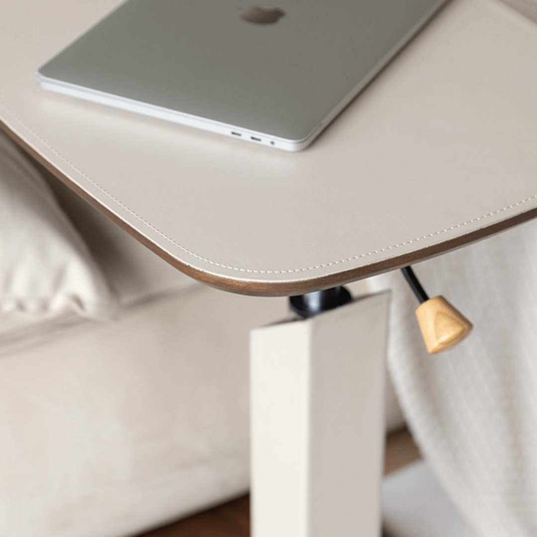 Movable end table in classic beige saddle leather, perfect for cozy living spaces