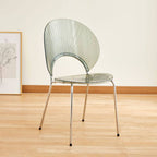 Stackable Scandinavian style dining chair with plastic seat, acrylic back, and silver legs