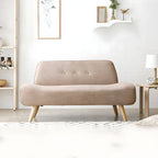 Small Scandinavian style sofa with wood frame and solid color polyester upholstery