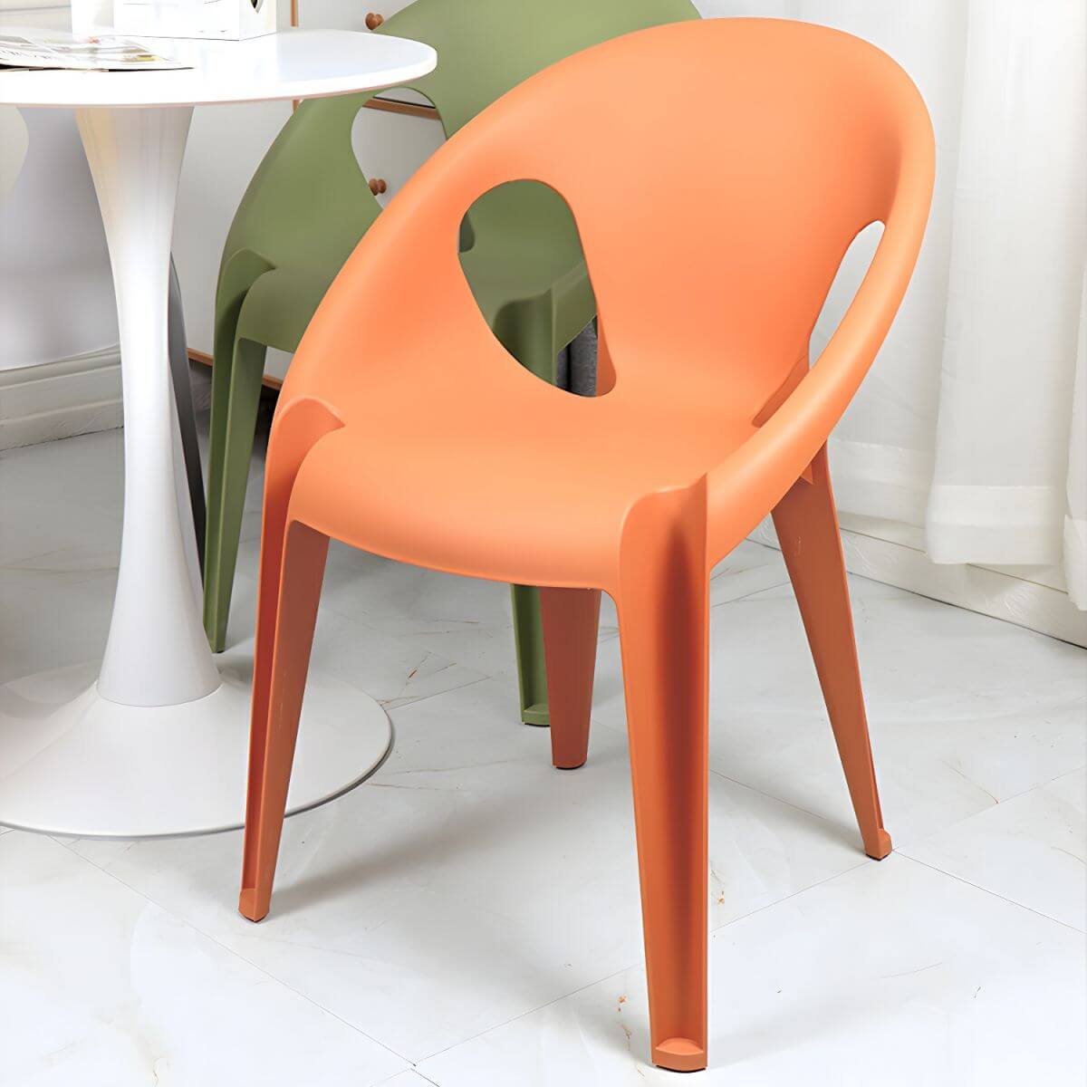 Stackable modern arm chair with open back made of plastic and acrylic for dining