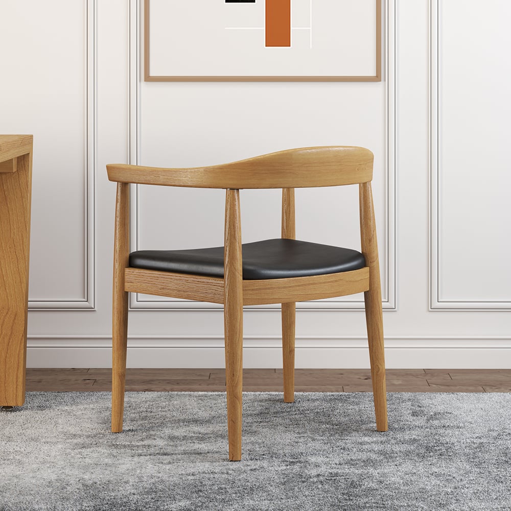 Set of four modern curved back dining chairs with walnut wooden frame and upholstered leather seats