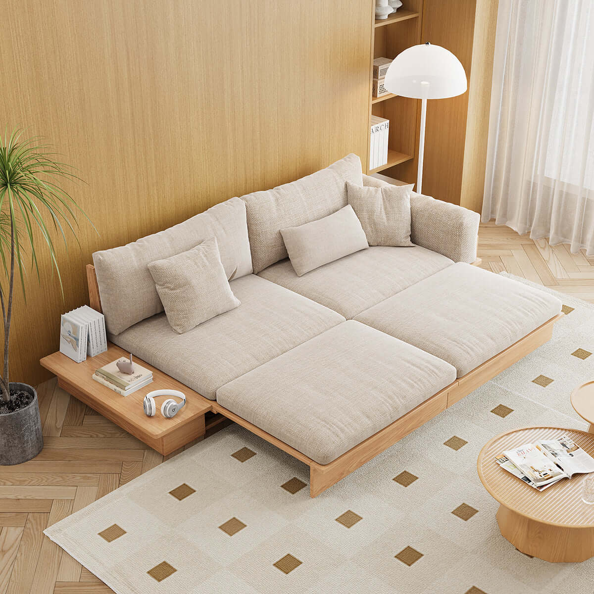 Modern pull-out floor sofa bed with reversible armrests and lift-top storage for space-saving comfort