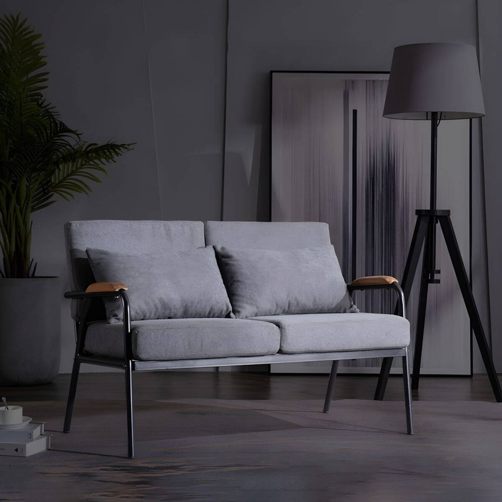 Mid century modern 2-seater sofa with black metal frame and solid wood arms