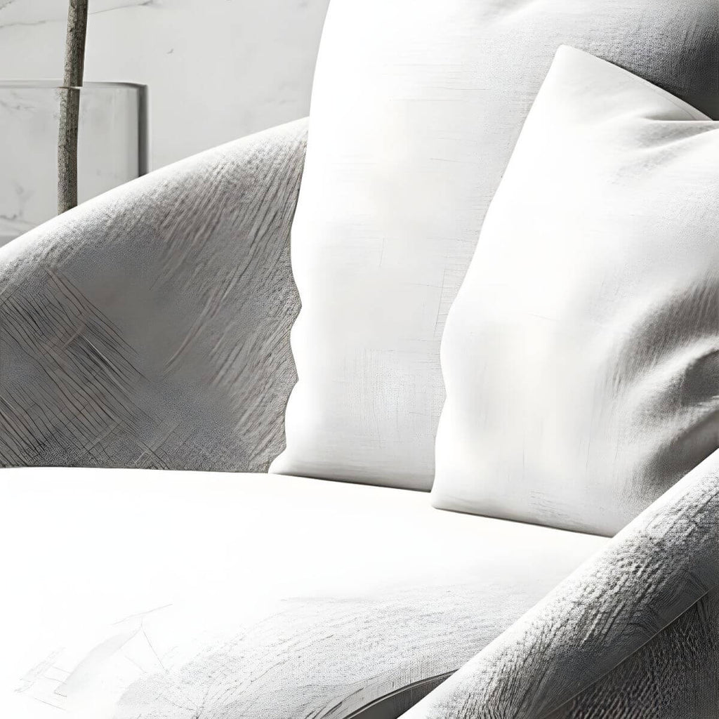 Scandinavian papasan chair with fixed back, sloped arms, cotton blend fabric, and 2 pillows